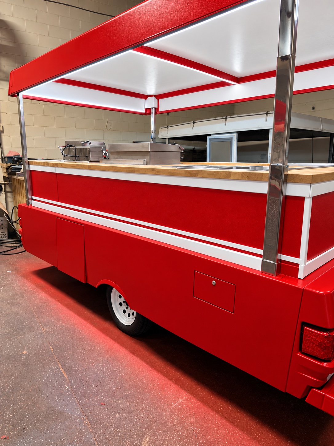 Butcher-block serving counter and red side panels